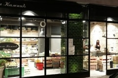 Mixed shades of olive with curved corners for a shop in Belgarde