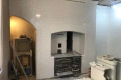 Arch tiles being installed. Colour: Snow