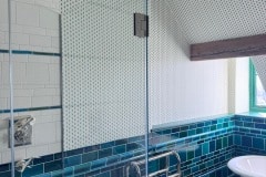Debenham blue bathroom wall tiles using tiles of different sizes