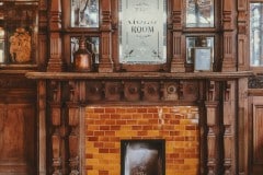 Mixed shades of golden brown fireplace and hearth tiles
