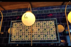 Pilkington tube lined decorative tiles with tulip border and dado. Deep blue field tiles shown