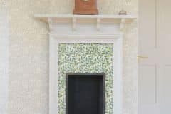 William De Morgan decorative fruit tree fireplace surround tiles.