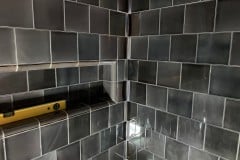 6"x6" grey tiles with curved corners into niche