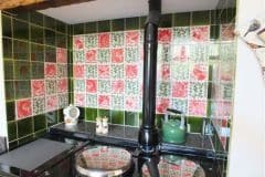William De Morgan red animals with vertical leaf spacers and olive surround