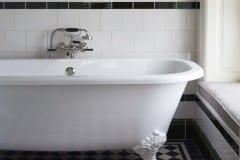 White engobe tiles with olive green skirting, dado and border