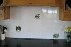 Tin white tiles with William De Morgan green animals