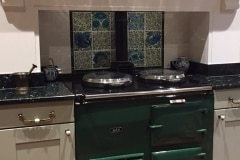 Aga panel using William De Morgan decorative tiles and flying leaf spacers