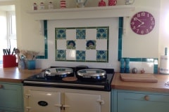 William De Morgan floral tile feature with tin white tiles