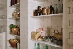 Tin white 6"x3" tiles set as Flemish Bond complete with curved external and internal corners and curved skirting to floor. Bespoke design and make by Artichoke Ltd. Photography: Christopher Horwood