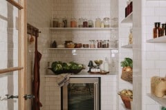 Tin white 6"x3" tiles set as Flemish Bond complete with curved external and internal corners and curved skirting to floor. Bespoke design and make by Artichoke Ltd. Photography: Christopher Horwood