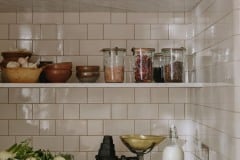Tin white 6"x3" tiles set as Flemish Bond complete with curved internal corners. Bespoke design and make by Artichoke Ltd. Photography: Christopher Horwood