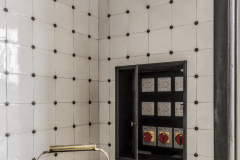 Tin white tiles with clipped corners and studs. Bespoke design and make by Artichoke Ltd. Photography by Emma Lewis