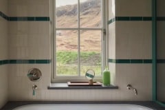 6"x2" craquelle en bisque plain tiles with Caspian feature borders. Designed by Waldo Studio