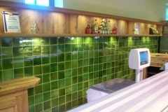 Mixed shades of olive tiles for farmshop