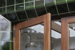 Dark olive external frost protected tiles with curved detailing