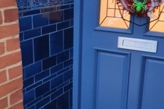Mixed shades of blue Porch Tiles (Porch Tiles) with tulip border, skirting and dado