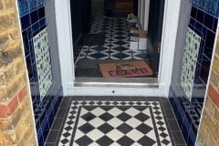 Porch 1 in dark blue tiles, with marine tulip border. Tubelined inserts