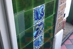 Olive porch tiles with William De Morgan fantastic birds