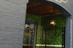Mixed shades of olive for bar entrance
