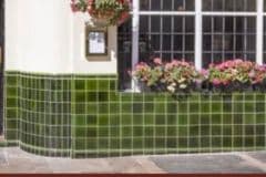 Mixed shades of olive for pub front