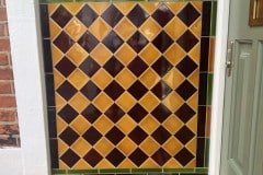 Bespoke porch tiles in teapot brown and honey