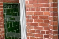 Dark olive porch tiles with skirting, tulip border and dado