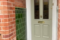 Dark olive porch tiles with skirting, tulip border and dado