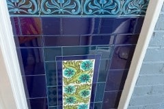 Porch external tiles with William De Morgan Daisy feature tiles, tulip border, skirting and dado