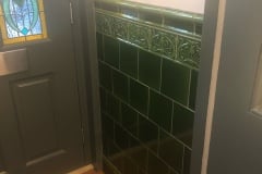 Dark olive porch tiles with skirting, tulip border and dado