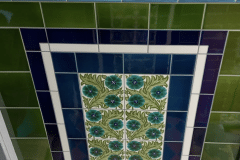 Olive porch design with William Morris daisies, complete with skirting, tulip border and dado. Tiled and photographed by Victorian tiled floors