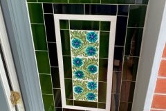 Olive porch design with William Morris daisies, complete with skirting, tulip border and dado