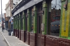 Teapot brown and dark olive external tiles for pub exterior