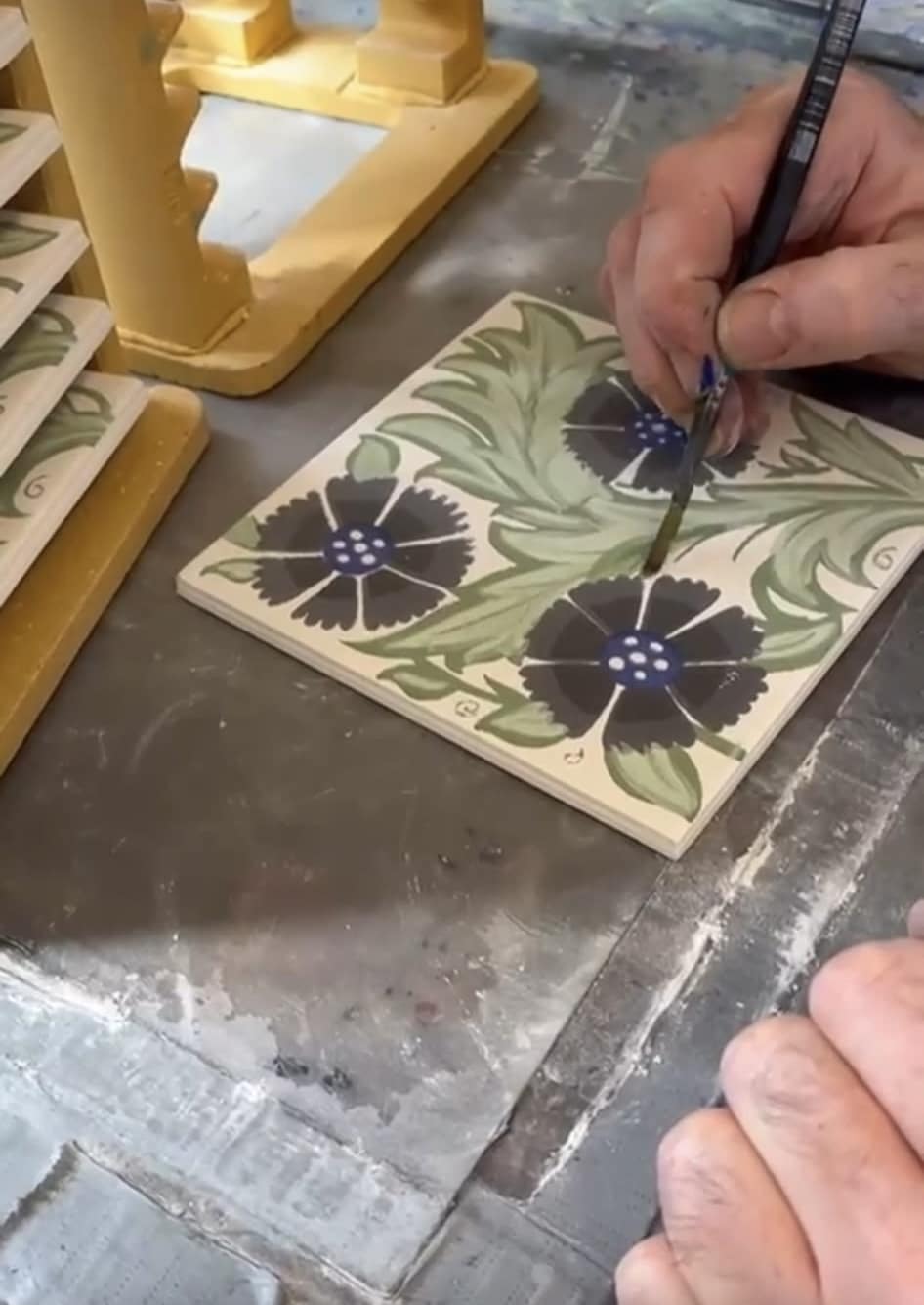 Hand painting our William De Morgan reproduction daisy tiles Hand painting our William De Morgan reproduction daisy tiles